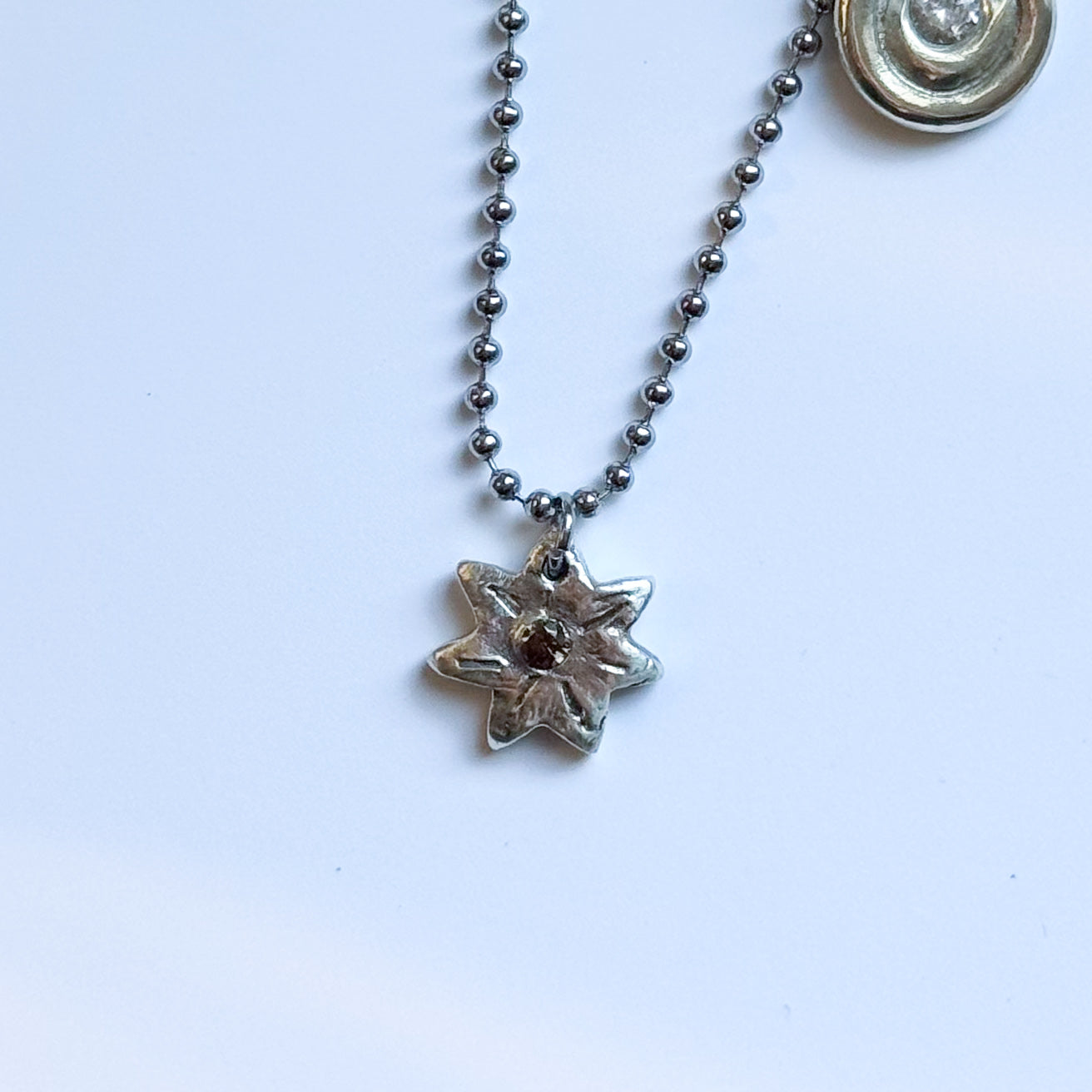 single sapphire starburst necklace